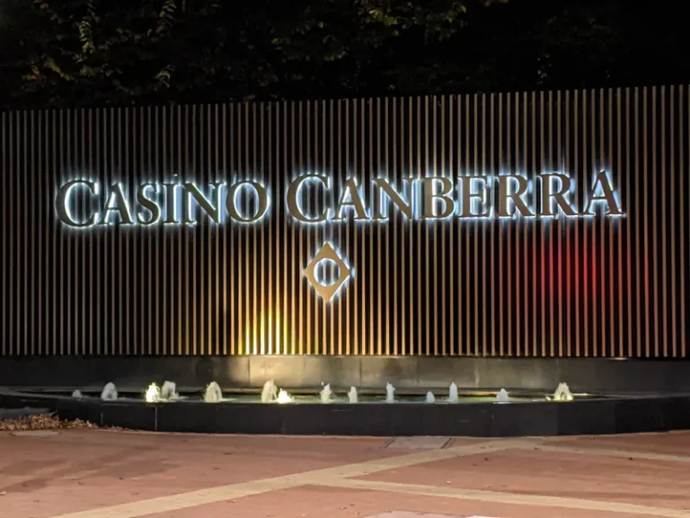 Illuminated Casino Canberra sign at night