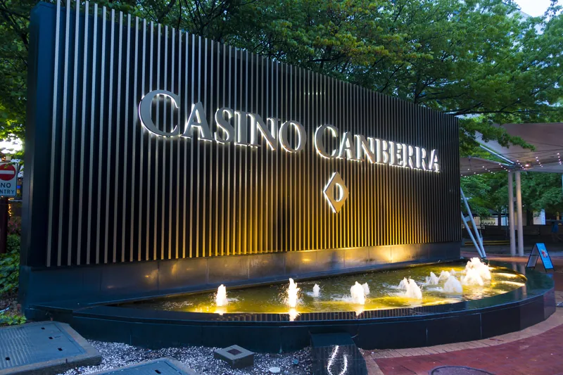 Casino Canberra sign beside illuminated fountains