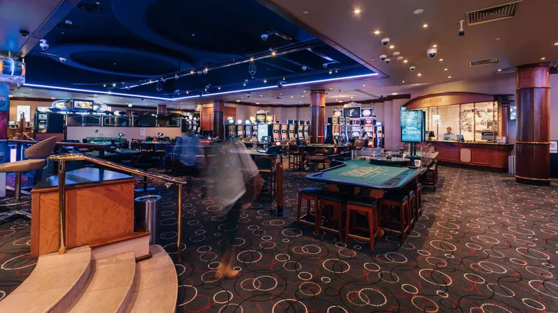 Gaming floor with tables at Country Club Casino