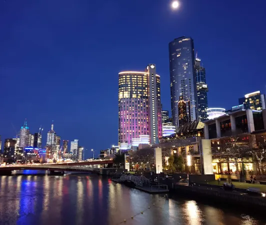 Crown Melbourne illuminated beside the river at night