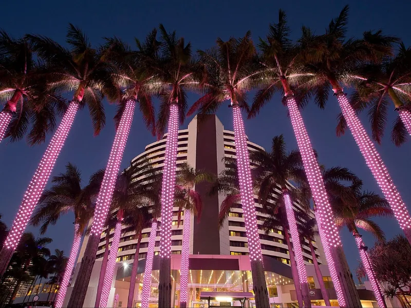 Illuminated palms outside The Star Gold Coast